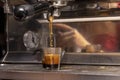 Expresso machine and coffee shots being processed for a drink at a Coffee house Royalty Free Stock Photo