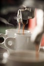 Expresso machine pouring two coffees Royalty Free Stock Photo