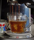 Expresso poured over hot water to make cafe americano Royalty Free Stock Photo