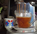 Expresso poured over hot water to make cafe americano Royalty Free Stock Photo