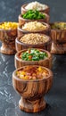 Exquisite array of gourmet spices and seasonings in wooden bowls on dark background