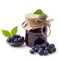 Exquisite bilberry jam marmalade jelly preserves in a glass jar, accompanied by fresh bilberries, showcased against a clean white