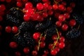 Delight in the vibrant harmony of luscious red currants and plump blackberries, a symphony of taste and beauty.