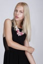 Exquisite Blond Woman with Flowery Necklace