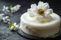 An exquisite cake featuring smooth white icing and a delicate, realistic sugar magnolia flower. Generative AI