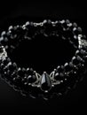 An exquisite choker crafted from black onyx and embedded with beads of obsidian beckoning to the mysterious side of life
