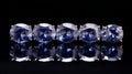 Exquisite Craftsmanship Row Of Blue Sapphire Stones On Black Background