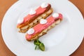 Exquisite cream dessert eclairs Royalty Free Stock Photo