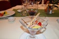 Exquisite dessert with ice cream, decorated with strawberries, fruit and wine, dinner in the restaurant