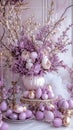 Elegant Lavender Easter Table Setting with Golden Eggs and Floral Arrangement Royalty Free Stock Photo