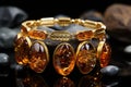 An exquisite and expensive amber bracelet on the hand. Royalty Free Stock Photo