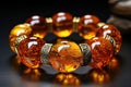 An exquisite and expensive amber bracelet on the hand. Royalty Free Stock Photo