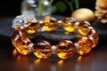 An exquisite and expensive amber bracelet on the hand. Royalty Free Stock Photo