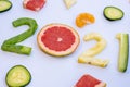 Exquisite fruits cut in the shape of the new year 2021 on a white table