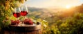 The exquisite glasses of red wine set against a stunning vineyard sunset..AI generated image Royalty Free Stock Photo