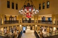 Exquisite interior of Souk Al Bahar market with huge chandelier, popular tourist destination, United Arab Emirates