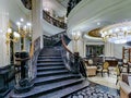 Exquisite interior of the St. Regis Moscow hotel with crystal chandelier and marble flooring on Nikolskaya street