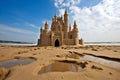 Exquisite and intricate sand castle standing proudly on the beautiful sandy beach shoreline