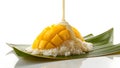 Exquisite mango sticky rice dessert presentation on lush banana leaf backdrop Royalty Free Stock Photo