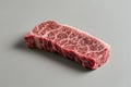 Exquisite marbled Wagyu beef steak on a simple gray surface