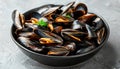 Exquisite mediterranean style grilled mussels elegantly presented on a sleek black plate