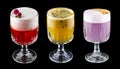 Exquisite original cocktails on a black background. Passion fruit, rose, plum Royalty Free Stock Photo