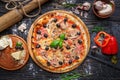 Exquisite pizza with ham, mushrooms and olives Royalty Free Stock Photo