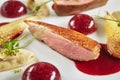 Exquisite Serving Creative Molecular Dish of Duck Breast, Baked Pear and Cherry Spheres