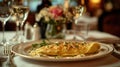 Exquisite serving of omelette for breakfast in a luxury restaurant. The table for two is elegantly set with crystal Royalty Free Stock Photo