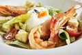 White Restaurant Plate of Caesar Salad with Shrimps, Chicken, Croutons, Tomatoes, Cucumbers Top View Royalty Free Stock Photo