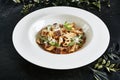 Exquisite Serving White Restaurant Plate of Homemade Italian Penne Pasta with Beef Cheeks Sauce