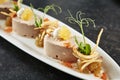 Exquisite Serving White Restaurant Plate with Mousse of Cod Liver, Onion and Crispy Chips Royalty Free Stock Photo