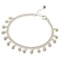Exquisite Silver Anklet with Tiny Bells isolated on white background Royalty Free Stock Photo
