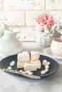 Exquisite spicy Camembert cheese, brie on a black plate with a cheese knife. Spicy snack for gourmets. Selective focus Royalty Free Stock Photo