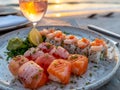 Exquisite Sushi Platter with Fresh Salmon, Shrimp, and Tuna at Sunset Gourmet Japanese Cuisine by the Sea Royalty Free Stock Photo