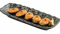 Exquisite traditional mediterranean grilled mussels elegantly served on a stylish black plate