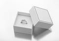 Exquisite women`s white gold diamond ring in an open white gold gift box with the lid removed Royalty Free Stock Photo