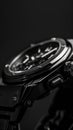 Exquisite wristwatch on black background, sleek modern design in black and silver tones, high-end luxurious feel