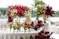 Exquisitely arranged and decorated wedding table outdoors on your wedding day. Beautiful flowers on the table on the wedding day. Royalty Free Stock Photo