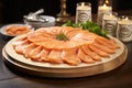 Exquisitely arranged smoked salmon slices on a charming and rustic wooden serving platter