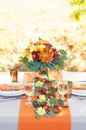 Exquisitely decorated table for two. Autumn themed table setting