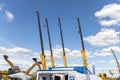 Telescopic booms of four mobile cranes XCMG with hook. Construction and repair equipment for lifting loads. XCMG stand