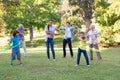 Extended family playing with hula hoops