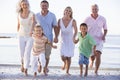 Extended family walking on beach Royalty Free Stock Photo