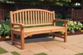 An extended long wooden bench seat set against a garden backdrop