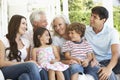 Extendend family sitting in Garden