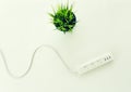 Extension cord with multiple asian plugs on living room at home Royalty Free Stock Photo