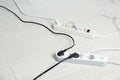 Extension cords on floor, space for text. Electrician`s equipment