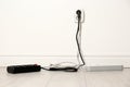 Extension cords with power plugs in socket indoors, space for text.