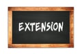 EXTENSION text written on wooden frame school blackboard